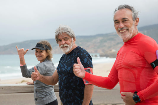 Three middle age people exercising and represents healthy aging
