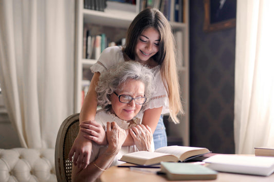 A grandchild and gran reading and making memories together