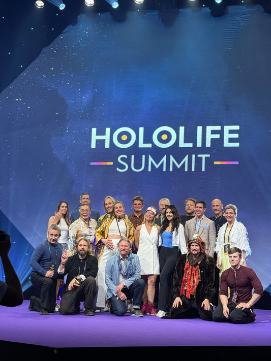 Speakers on stage at a Summit 