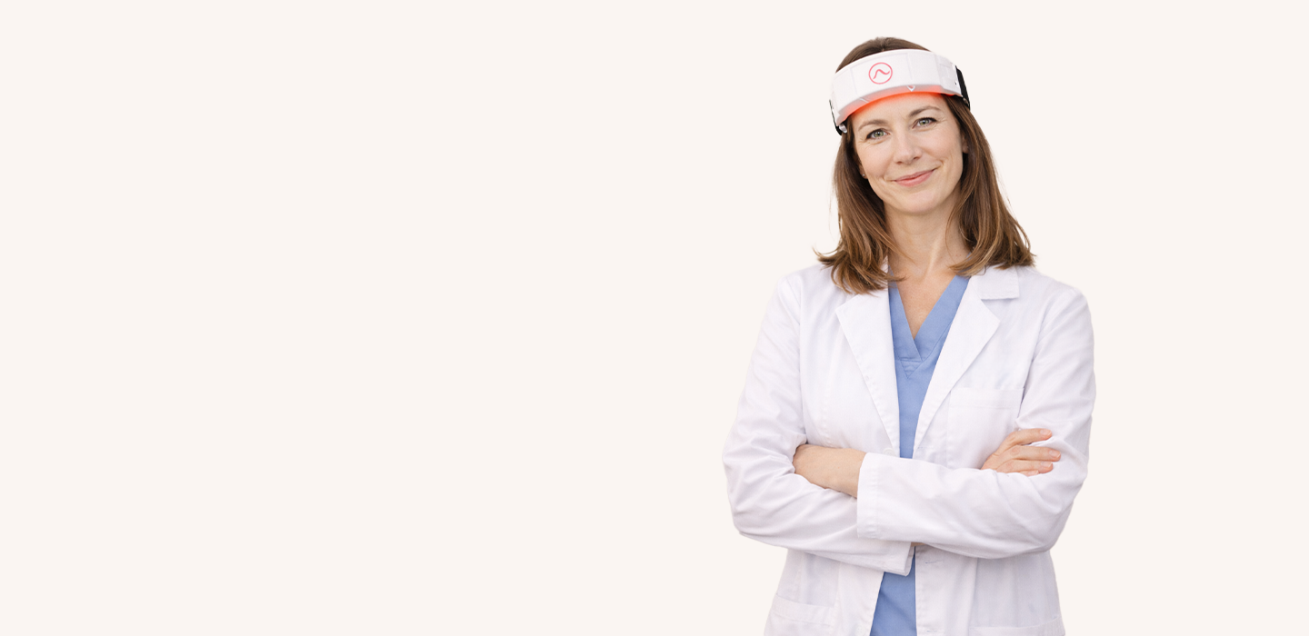 Female healthcare professional wearing a CERA System red light therapy headband for brain health, desktop banner view.